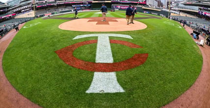 Apr 28, 2023; Minneapolis, Minnesota, USA; A general view as the grounds crew walks on the field during a rain delay prior to the game between the Minnesota Twins and the Kansas City Royals at Target Field. Mandatory Credit: Jeffrey Becker-USA TODAY Sports