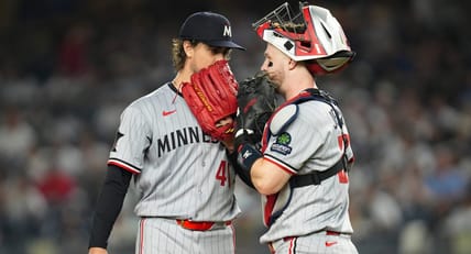 Minnesota Twins pitcher Joe Ryan (41) and Minnesota Twins catcher Ryan Jeffers (27) talk at the mound during a game against the