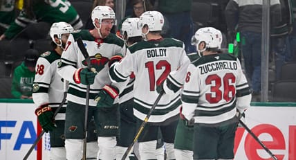 Mats Zuccarello, Matt Boldy and Michael McCarron dap up during Stanley Cup Playoffs - Minnesota Wild at Dallas Stars
