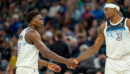 Mar 9, 2025; Minneapolis, Minnesota, USA; Minnesota Timberwolves guard Anthony Edwards (5) shakes hands with forward Jaden McDaniels (3) after making a shot against the San Antonio Spurs in the first half at Target Center. Mandatory Credit: Jesse Johnson-Imagn Images