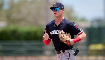 Minnesota Twins top prospect Walker Jenkins jogging in the outfield with glove on