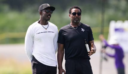 Minnesota Vikings GM Kwesi Adofo-Mensah hanging with former Vikings wide receiver Cris Carter at 2025 training camp