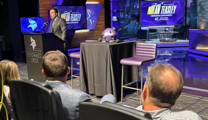 Rob Brzezinski and Kevin O'Connell watch on as Nolan Teasley is introduced at TCO Performance Center as Minnesota Vikings general manager