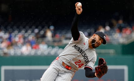 Simeon Woods Richardson falling over as he throws a pitch for the Minnesota Twins against the Washington Nationals