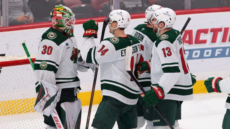 Joel Eriksson Ek celebrates with Jesper Wallstedt and other Minnesota Wild teammates vs Florida Panthers