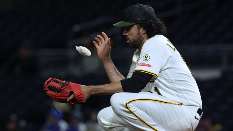 New Minnesota Twins pitcher Justin Lawrence squatting down on the mound while pitching for the Pittsburgh Pirates against the San Diego Padres
