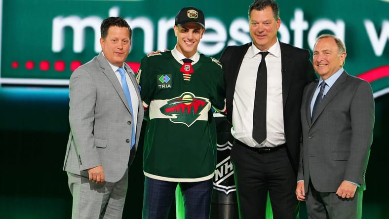 Minnesota Wild - (left to right) Judd Brackett, Zeev Buium, Bill Guerin and NHL commissioner Gary Bettman on stage at the 2024 NHL Draft in Las Vegas