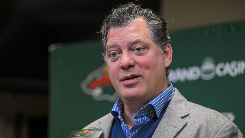 Minnesota Wild president of hockey operations Bill Guerin speaking to reporters at a podium in St. Paul, MN.