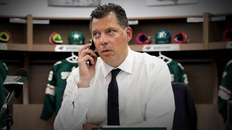 Minnesota Wild president of hockey operations Bill Guerin on the phone