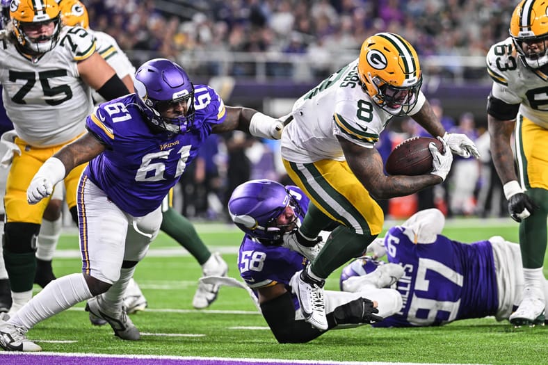 (DT) Jalen Redmond tries to wrestle down (RB) Josh Jacobs: Green Bay Packers at Minnesota Vikings