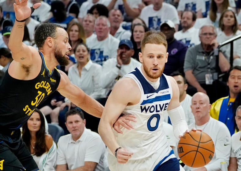 Steph Curry guarding Donte DiVincenzo - NBA Playoffs - Golden State Warriors at Minnesota Timberwolves